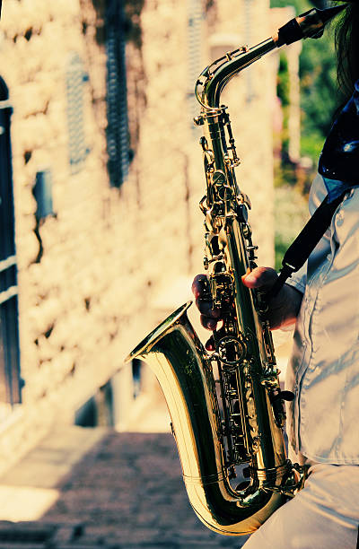 istock Saxophonist holding saxophone 473796674