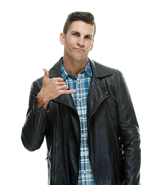 istock Casual man showing shaka sign 473796684