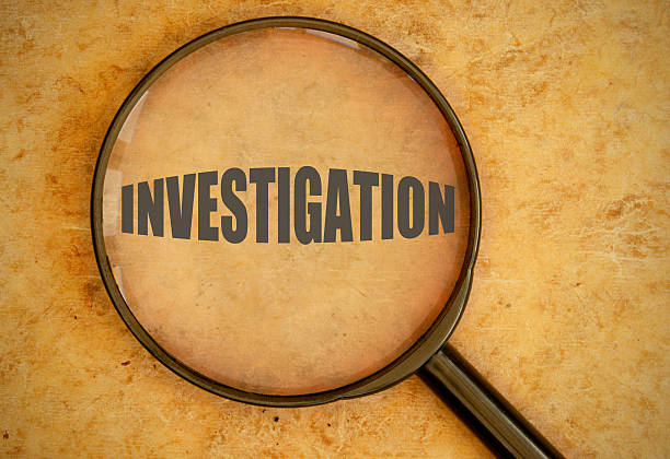 istock A magnifying glass revealing the word INVESTIGATION  473800928