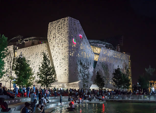 Milan, Italy - May 14, 2015: Expo 2015 at night, People are looking The Tree of Life lights under the Italian Pavilion