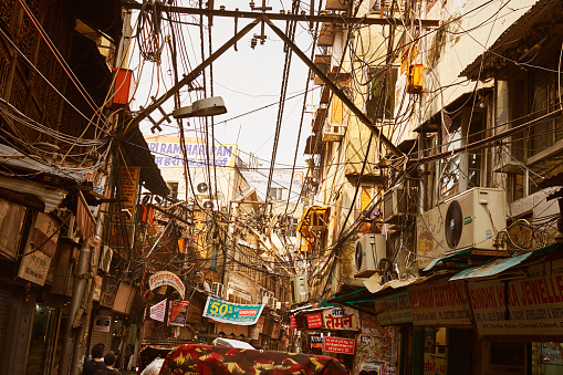 Street View Of New Delhi, India With Messy Electric Cables And A Lot Advertising