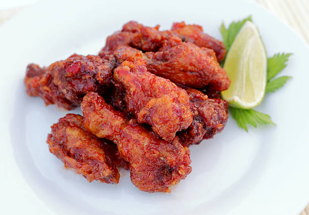 istock chicken wing with sweet chili sauce 473809700