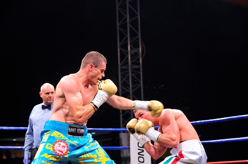 Oviedo, Spain - May 16, 2015: Aitor Nieto of Spain beat Estonian Pavel Mamontov by decision to win the European IBF and USBA welterweight championship in May 16, 2015 in Oviedo, Spain. Aitor Nieto (L) tries to beat the Estonian Pavel Mamontov (R).