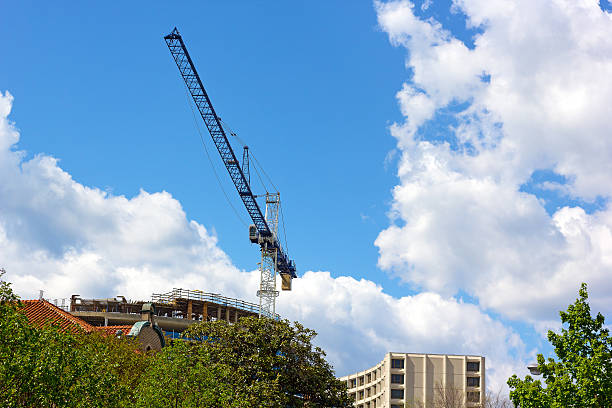 istock Blue construction crane in the city. 473818600