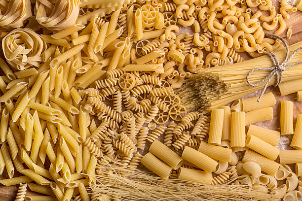 Pasta Variety of types and shapes of dry pasta noodles stock pictures, royalty-free photos & images