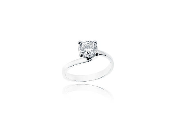 istock Diamond solitaire jewelry ring isolated on white background 473827080