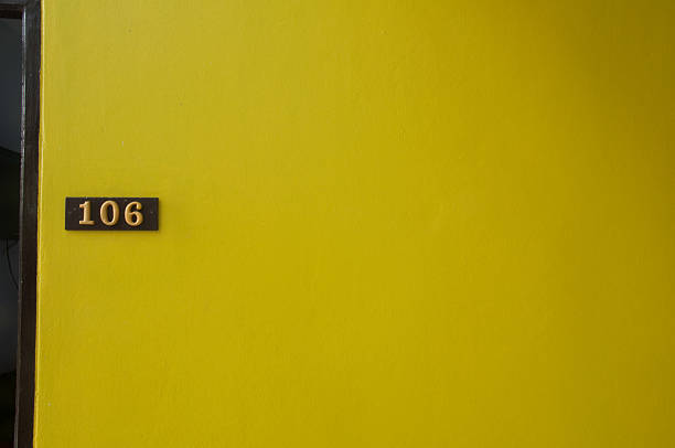 istock number room on yellow wall 473827144
