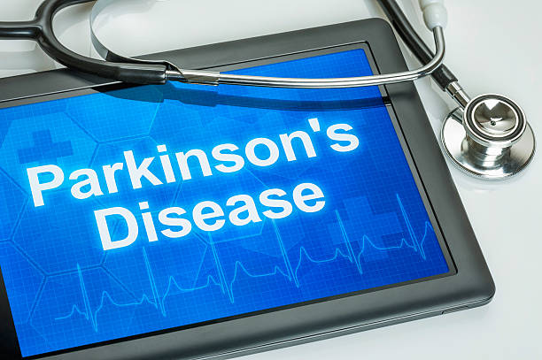 Tablet with the diagnosis parkinson's disease on the display Tablet with the diagnosis parkinson's disease on the display parkinsons disease photos stock pictures, royalty-free photos & images