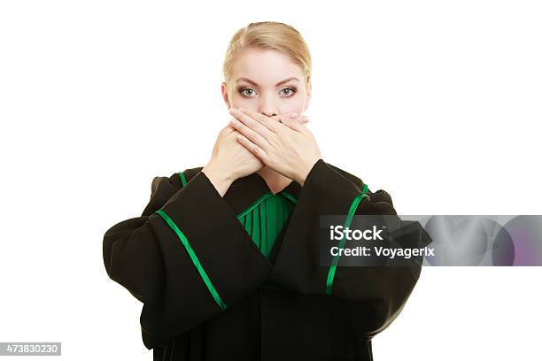 Woman Lawyer Barrister Covering Mouth With Hands Stock Photo - Download Image Now - 2015, Adult, Advice