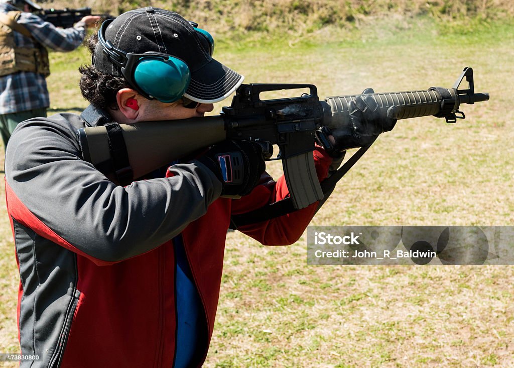 The Marksman The marksman shooting target practice.  Good guy with a gun. Kalashnikov Stock Photo