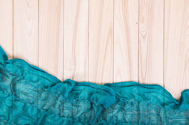istock green scarf on wooden background 473834230