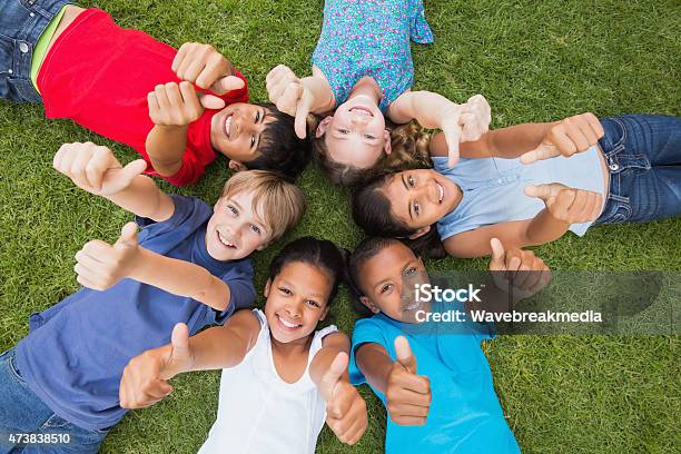 Happy Friends Playing In The Park Stock Photo - Download Image Now - Child, Playing, Thumbs Up