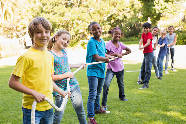 istock Happy friends playing in the park 473838518