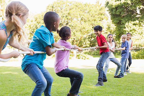 istock Happy friends playing in the park 473838534