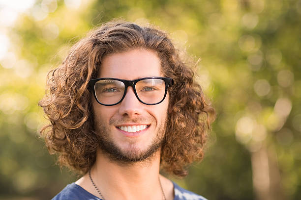 istock Handsome hipster in the park 473839144