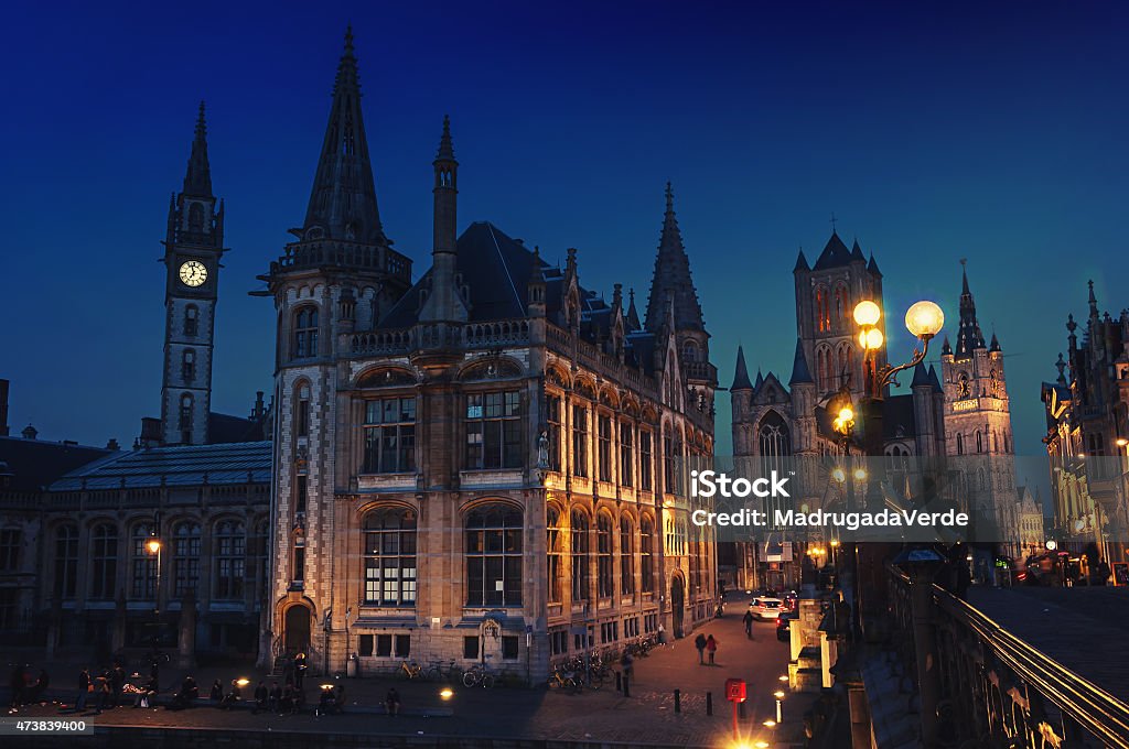Ghent in Belgium at night Ghent in Belgium at night. Medieval old part of the famous Flemish city which is held well preserved. Sant - Nicholas Church, bridge and The Graslei area. 2015 Stock Photo