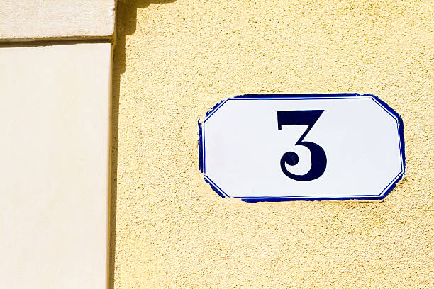 istock Number 3 Street Address Tile On Yellow Wall 473847222