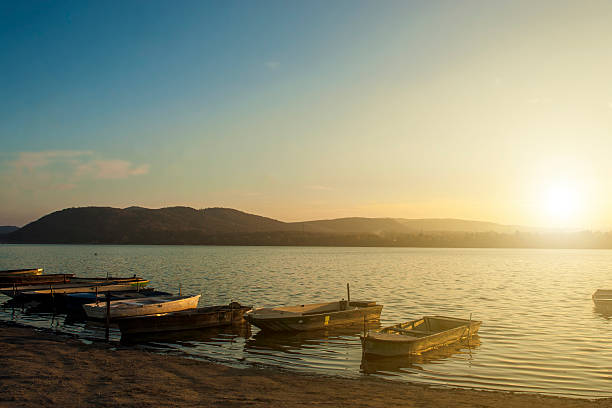 istock Fishing boats in sunset 473848567