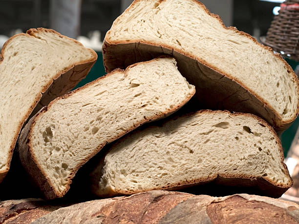 forms of homemade bread on one another stock photo