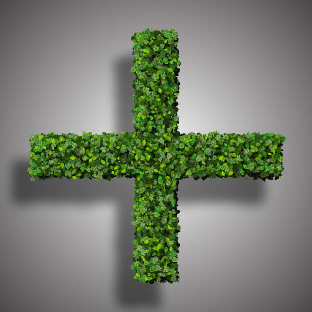 istock Pharmacy cross, Plus with ring, sign made from green leaves. 473850404