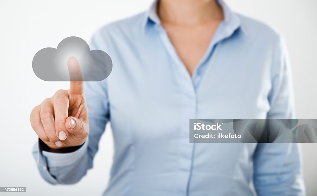 Businesswoman pressing cloud icon on the digital touch screen unrecognizable businesswoman pressing cloud icon on the digital touch screen of a tablet pc 2015 Stock Photo