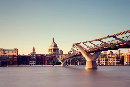 London cityscape with St Paul's Cathedral and Millennium Bridge at day. Long exposure, ND filter.