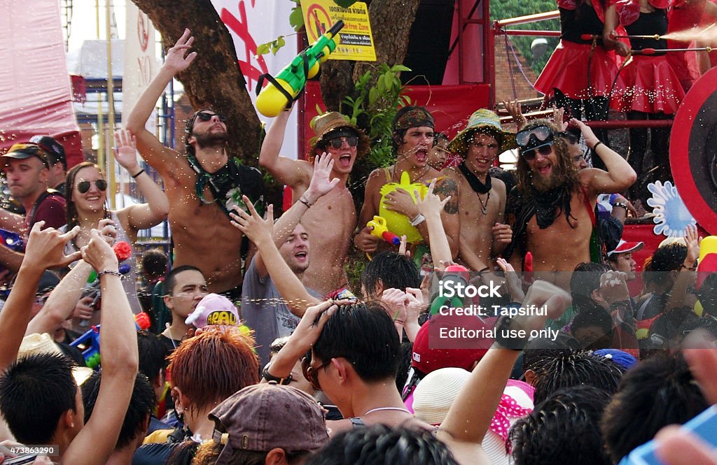 People celebrating at the Songkran festival in Thailand Chiang Mai, Thailand - April 14, 2013: People celebrating the Songkran festival on the street in Chiang Mai. Drunk Stock Photo