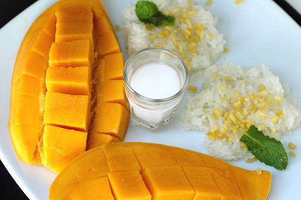 istock sticky rice with coconut milk mix and ripe mango. 473867692