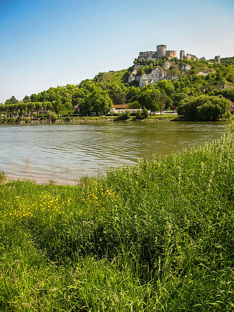 istock Ruins of  ancient castle on river shore, Les Andeles, Fran 473868218