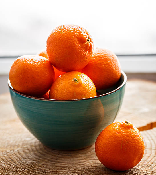 istock Tangerines on the wooden table 473868866