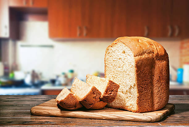 istock Fresh homemade bread on the kitchen table 473876906