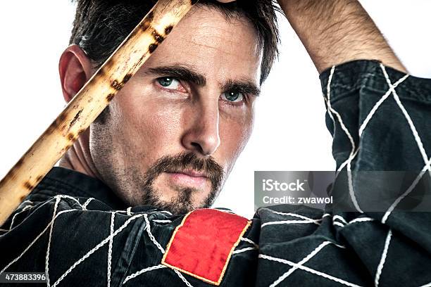 Martial Arts Master With Bamboo Sticks Stock Photo - Download Image Now - 2015, Activity, Adult