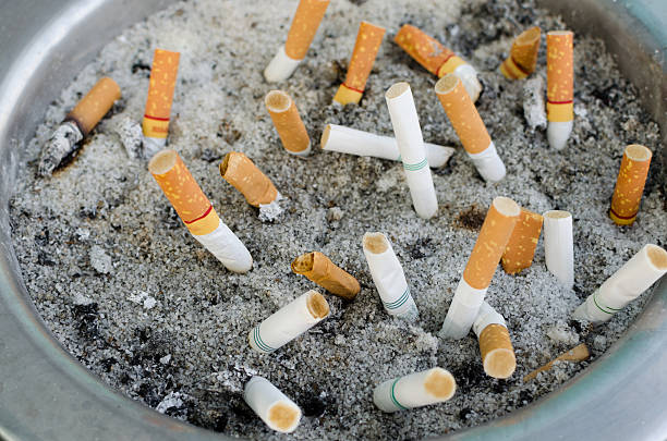 istock smoked cigarettes in a dirty ashtray 473883880