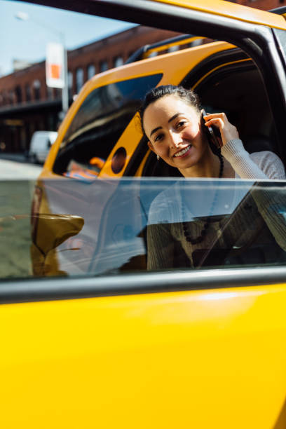 istock Business woman using the taxi 473895592