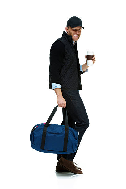 istock Smiling casual man holding coffee cup 473898096