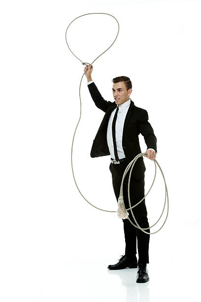 istock Smiling businessman lassoing 473898108