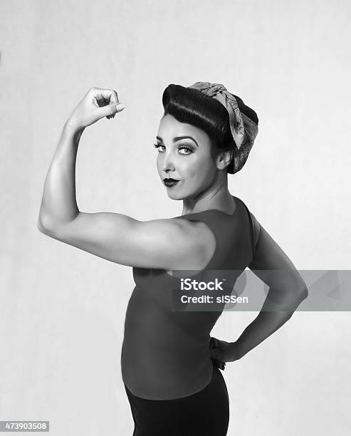 Woman Biceps Showoff Stock Photo - Download Image Now - Women, 1940-1949, Muscular Build