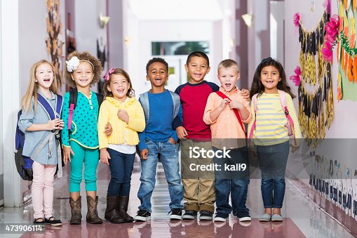 istock Multiracial group of children in preschool hallway 473906114