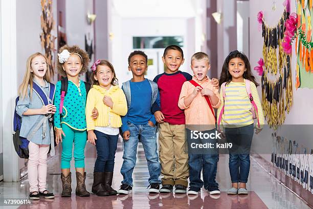 Multiracial Group Of Children In Preschool Hallway Stock Photo - Download Image Now - Child, Preschool, Happiness