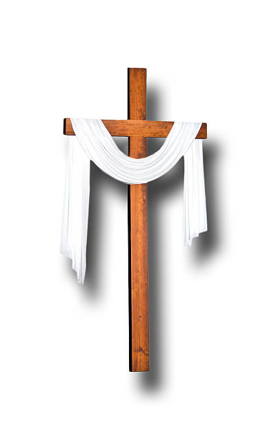 istock Easter morning crucifix with white shroud on white- highlighted 473906450