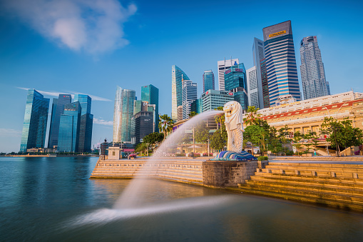 Singapore, Singapore - September 1, 2014: The Merlion fountain in front of the Marina Bay Sands hotel on September 01, 2014 in Singapore. Merlion is a imaginary creature with the head of a lion, seen as a symbol of Singapore