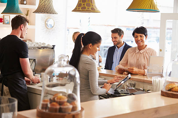 istock Cashier taking an order in cafe 473909132
