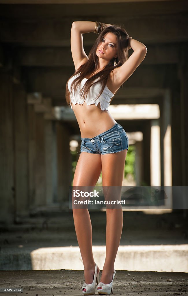 Woman Denim Shorts And Tshirt In Urban Background Stock Photo Download Image Now iStock