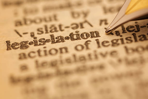 Dictionary Series : Legislation Legislation pen nib pointing to the words in the dictionary, shot with very shallow depth of field, bill legislation photos stock pictures, royalty-free photos & images