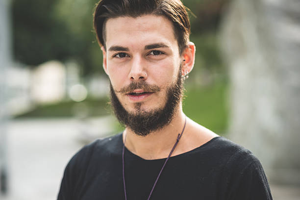 young handsome bearded hipster man stock photo