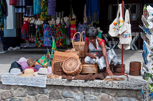Roseau, Dominica - December 4, 2011: A souvenirs vendor along the main harbor street in Roseau, Dominica.