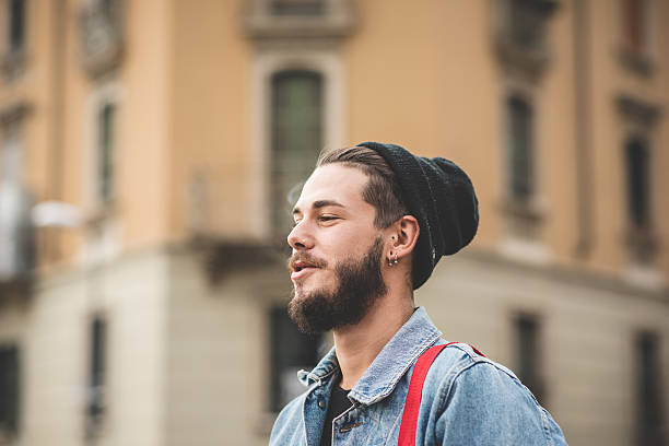 istock young handsome bearded hipster man smoking cigarette 473919780