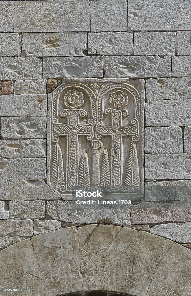 Religious symbol carved on the stone Religious symbol carved on the stone in italian town 2015 Stock Photo