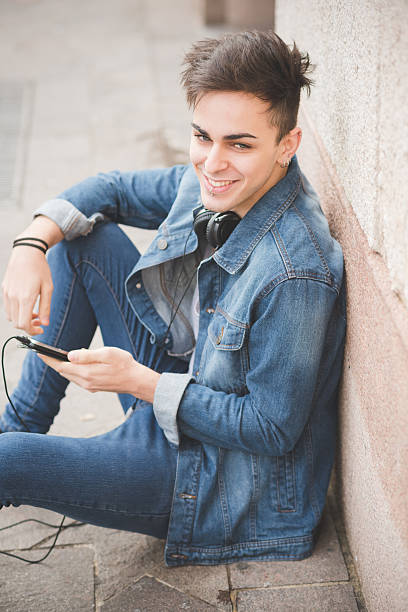 istock young handsome alternative dark model man in town 473920490