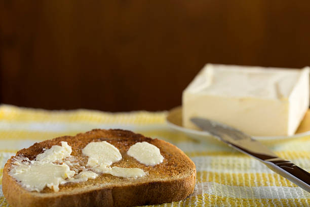istock Slice of white buttered toast 473920702